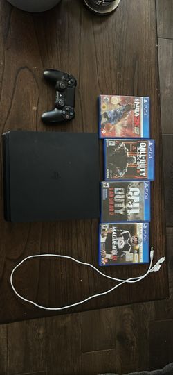 PS4 slim 1tb+4 games with controller and cords