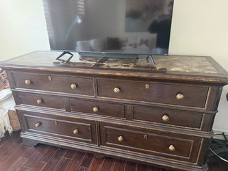FREE Multi-drawer dresser with stone top and brass tone knobs