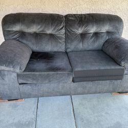 Dark grey love seat/sofa $100