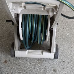 Garden hose mobile reel cart, hose  and nozzle included.  Very good condition,  no more need it 