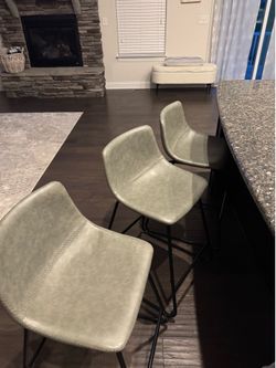 3 gray bar stools