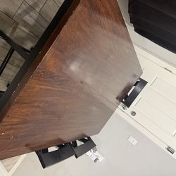Wood table has some stains and chips