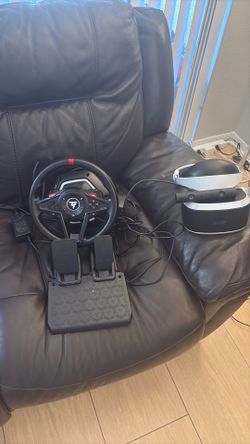 Thrustmaster steering wheel with pedals + PlayStation VR headset.