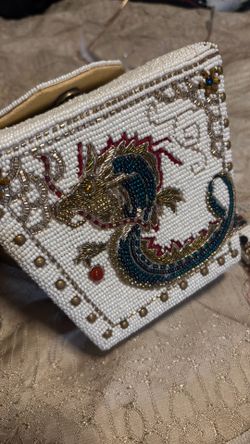 region is a Mary Frances "Noble Dragon" Handbag, designed to look like a classic Chinese takeout box container