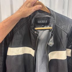 Guess black leather men’s waist jacket extra large with a white stripe. $50