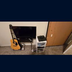 PS4, TV with remote and an Acustic GUITAR