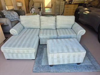 Bob’s Furniture Light Blue Sectional Sofa + Storage Ottoman – Converts to Bed – Great Condition