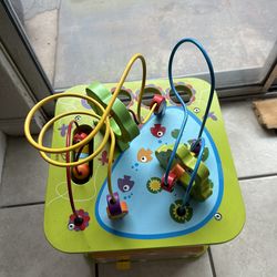 b toys  wooden activity cube assortment and plastic horse