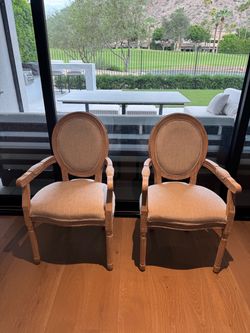 2 upholstered dining chairs with arms
