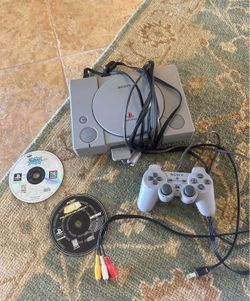 PlayStation with 2 games
