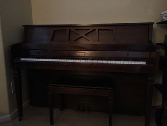 Upright Piano With Bench And Books
