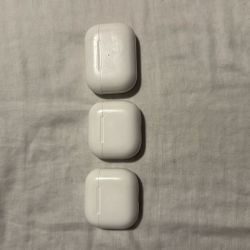 Three AirPods Cases With With Missing Buds And AirPods Case