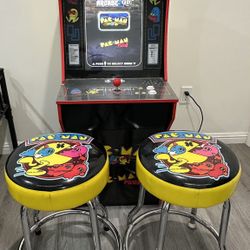 Pac-Man arcade machine with stools