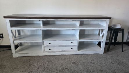 Both Entertainment center and ottoman/coffee table