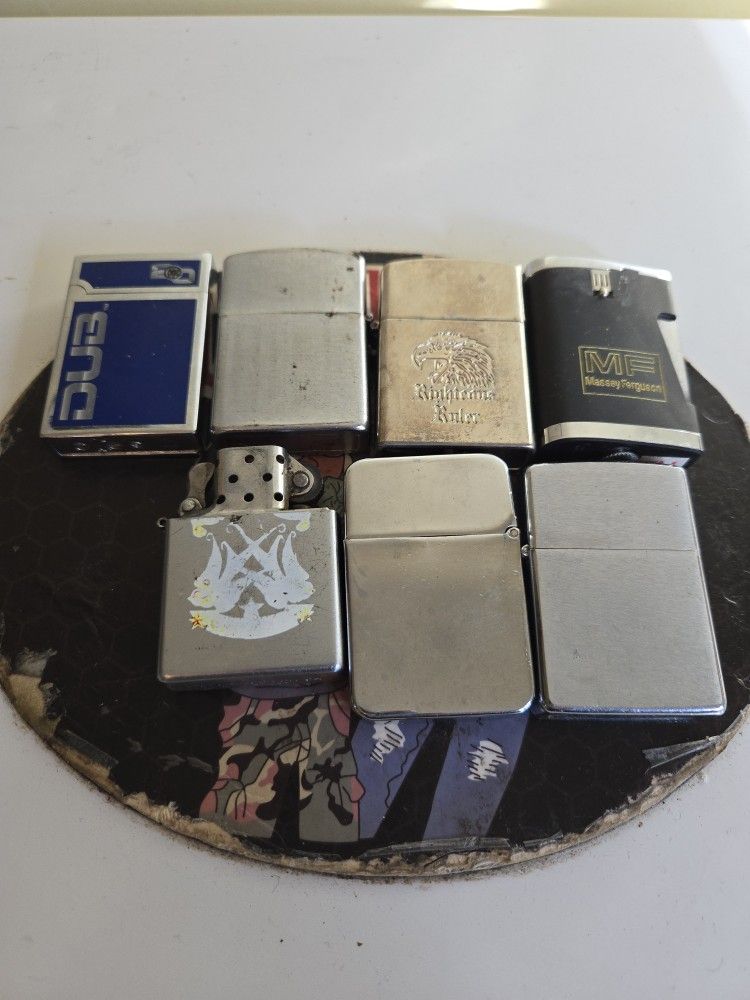 Seven vintage zippo lighters