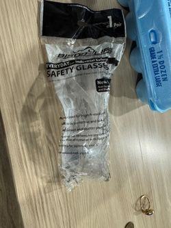 A pair of clear safety glasses
