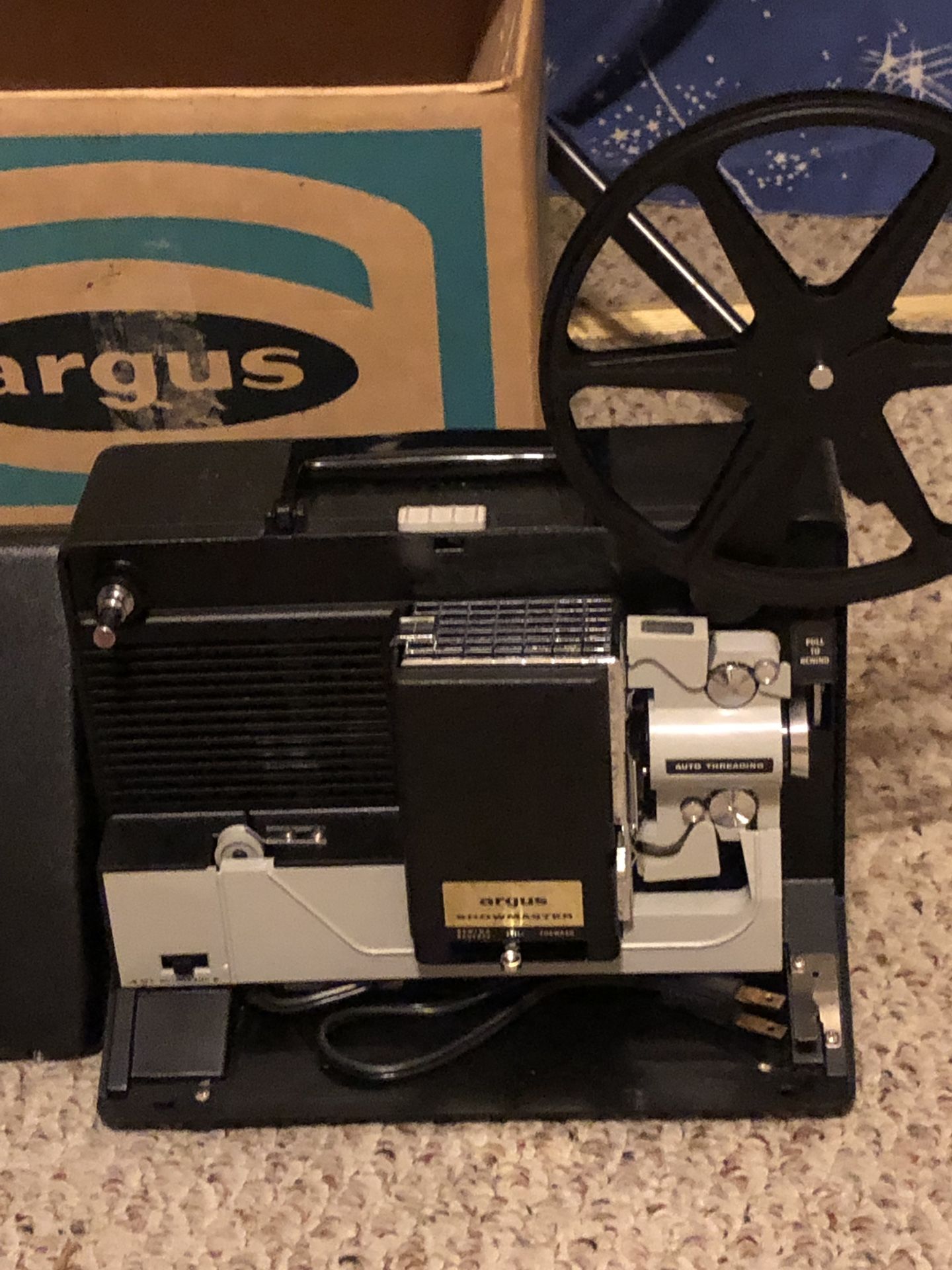 8 mm Argus Showmaster movie projector and screen.