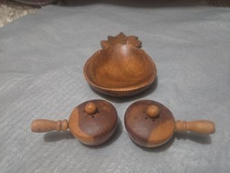 vintage mid-century wooden pineapple condiment serving set consisting of a carved, pineapple-shaped serving dish salt and pepper shaker set,