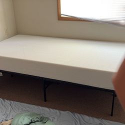 Twin foam bed with metal bed frame