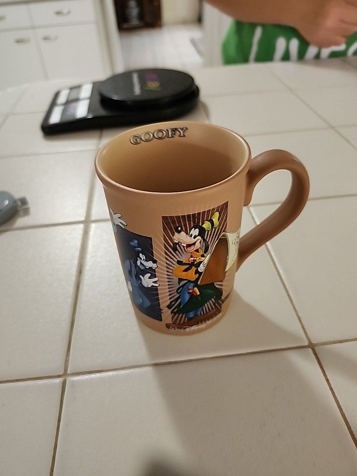 Walt Disney World Evolution of Goofy Scenes Brown Tan 12 oz Coffee Mug