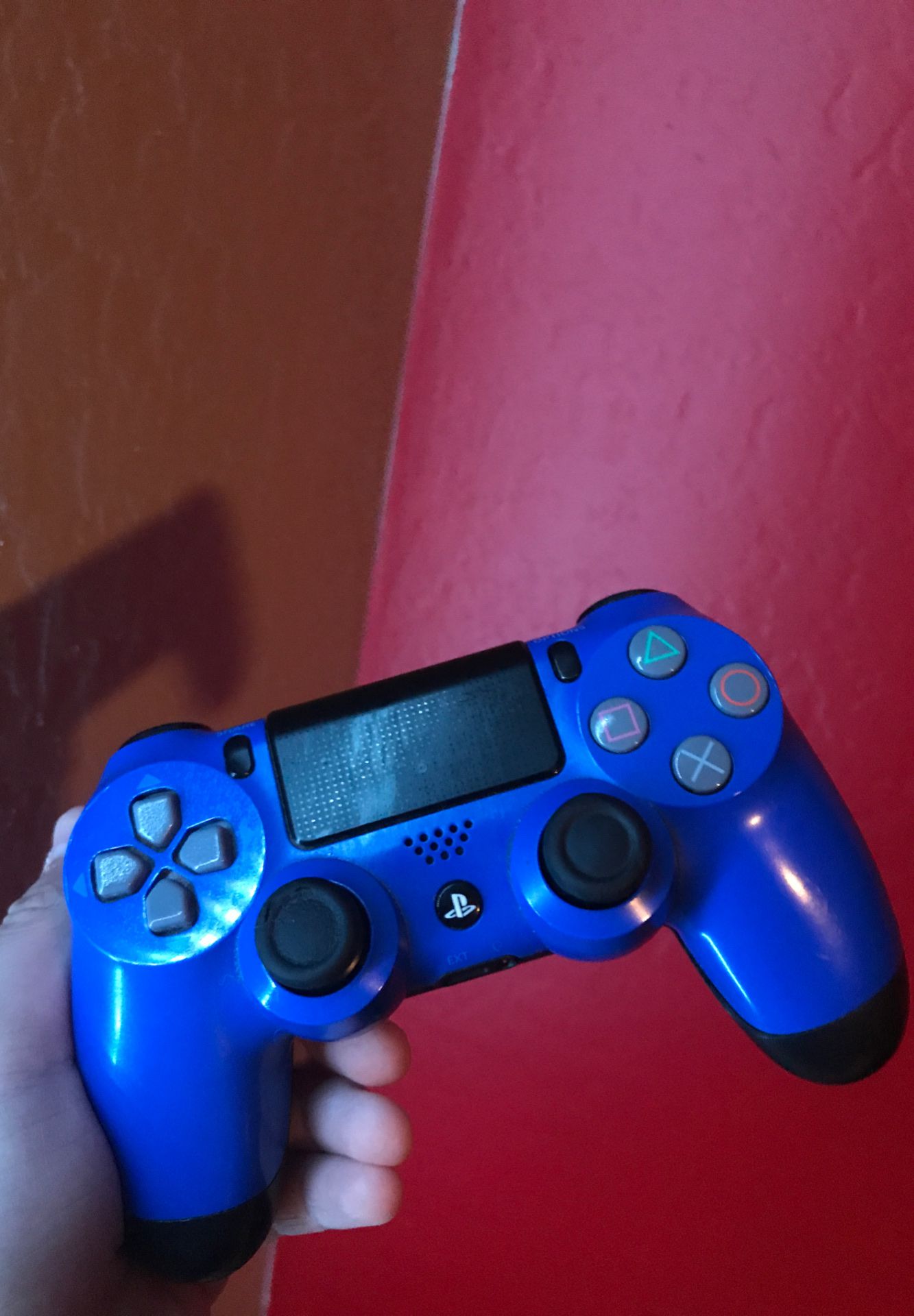 Blue and black ps4 controllers.