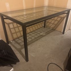 Glass top table and four chairs