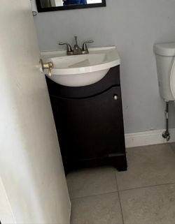 Dark Wood Bathroom Vanity with White Sink