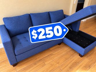 Blue two piece sectional sofa with RAF storage chaise