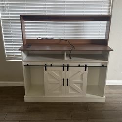 Farmhouse-style TV stand/console with sliding barn doors and a hutch top