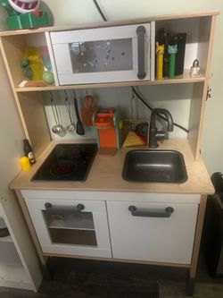 Kids kitchen set comes with extras, coffee makes tools all kinds of stuff