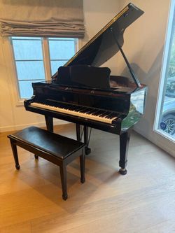 Pristine baby grand piano in excellent condition going for free with bench