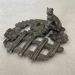 Vintage Metzke pewter cat sitting on a fence decorative lid or trivet.