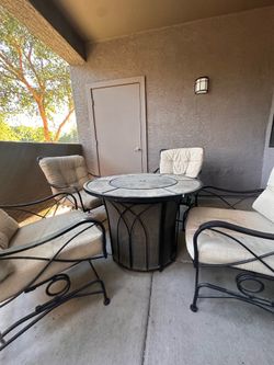 Four piece patio chairs with gas fire pit table