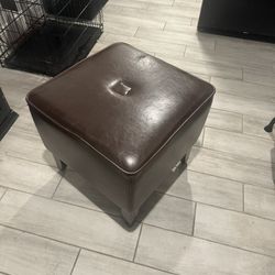 Cute little ottoman has one little scratch doing great shape delivery fee curbside drop off New Jersey only