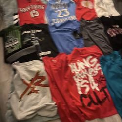 Large lot of men’s  medium shirts very few large, about 29 T-shirts, one long sleeve shirt, 10 tank tops, 2 jerseys.  Some still have tags on them.  B