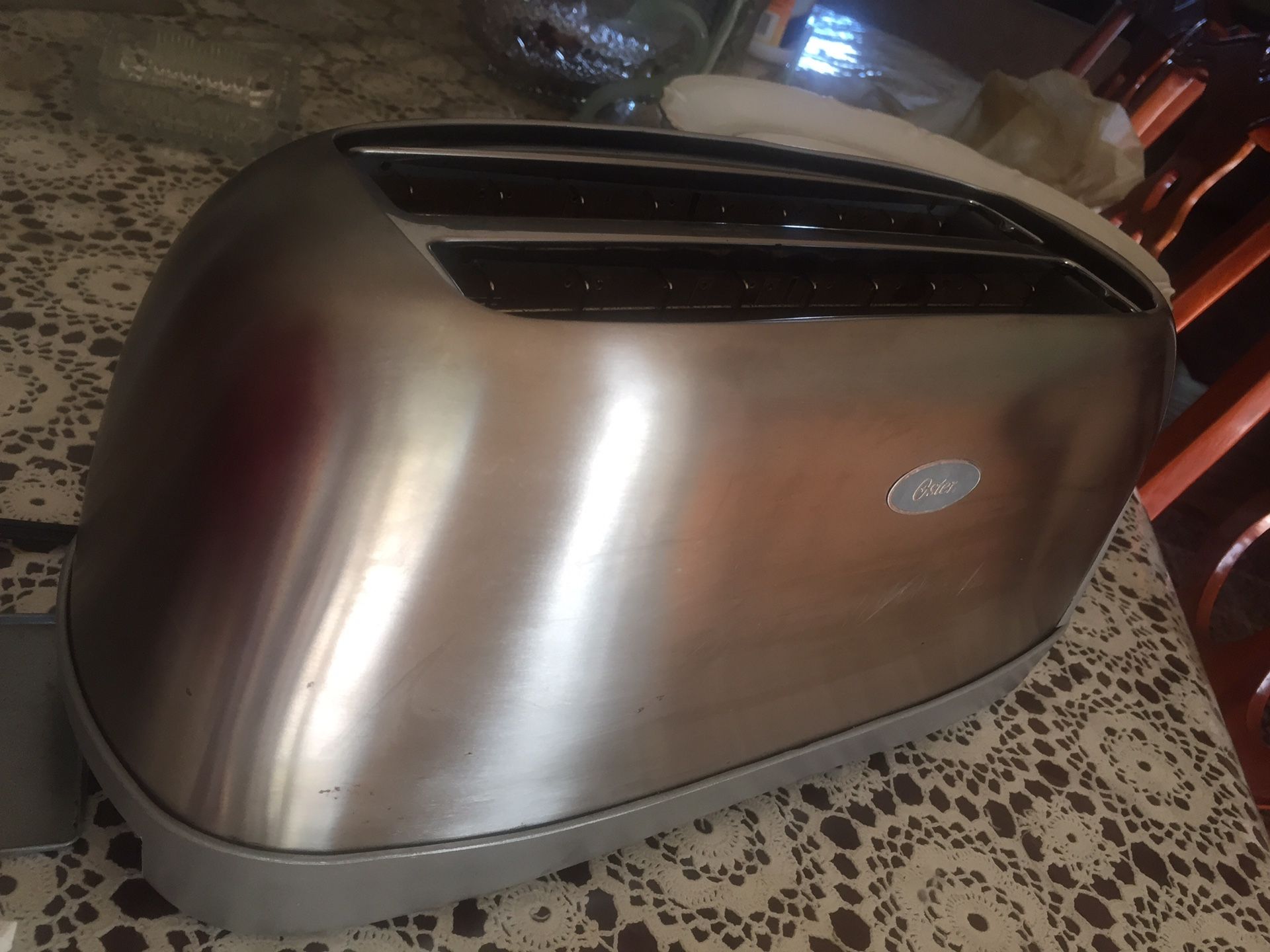 Oster Stainless Steel Silver 4 slot Toaster 7.3 in. H x 6.9 in. W x 16 in. D