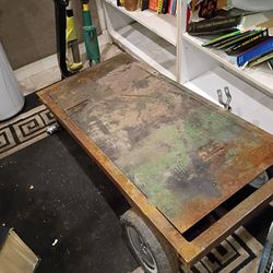 Industrial metal platform cart missing front wheels but hubs for tires are there in the front