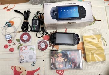 PSP 1000 value bundle with game and movies!