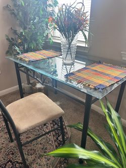 Metal chair, metal table with a glass tabletop