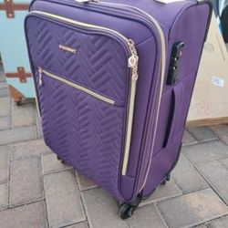 Purple carry-on luggage with tote bag