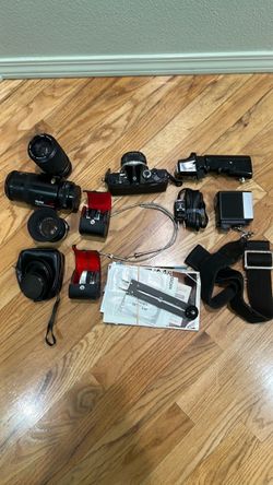 Vintage Olympus OM-1 35mm film SLR camera with bundle