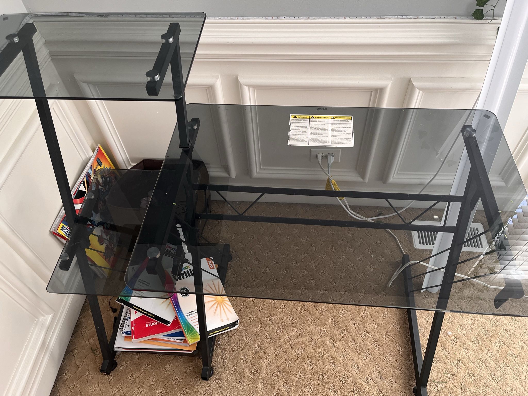Black frame glass computer desk with shelves.