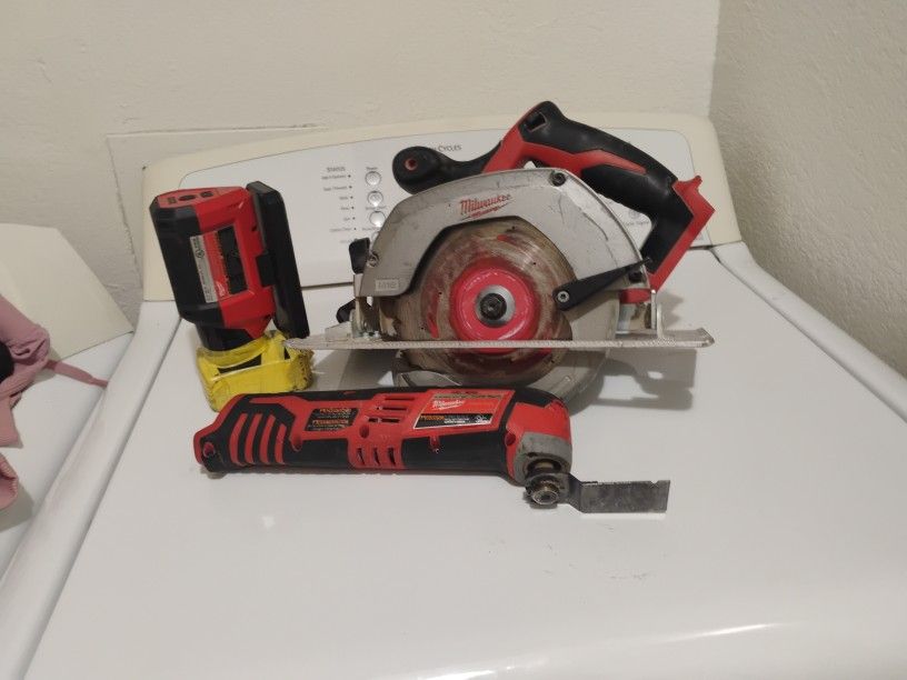 Milwaukee Multi Tool ,Rover Service And Repair Flood Light, And Circular Saw.
