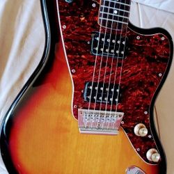 Gorgeous Squier Jaguar guitar, Hard Tail with Duncan Designed pick ups & Push / pull nice action, Classic Burst & D'Luxe pick guard + Gig Bag