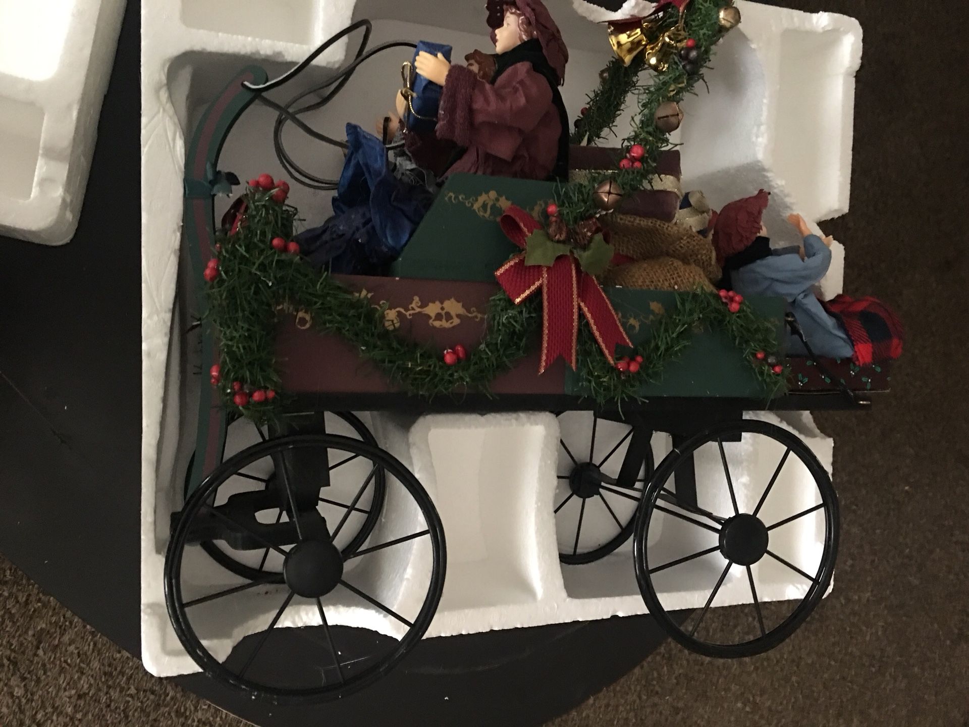 Traditions hand crafted & hand painted family in holiday carriage