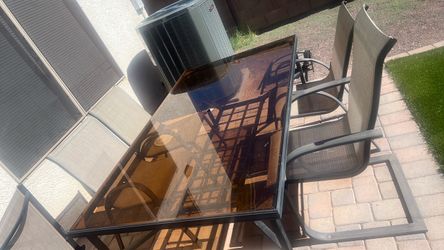 Patio glass table with four chairs