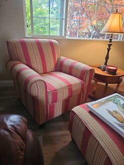 Chair With Ottoman With A Soft Yellow Gold, Red, And Cream Stripes