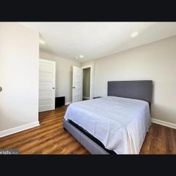 Gray Upholstered Bed Frame with Studded Headboard. Nightstand included.