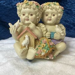 Ceramic cherub figurine