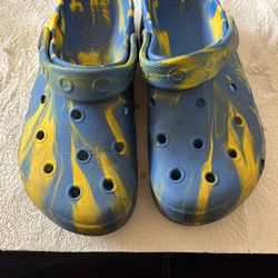 Small Kids Crocs With A Tie-Dye Art Style.